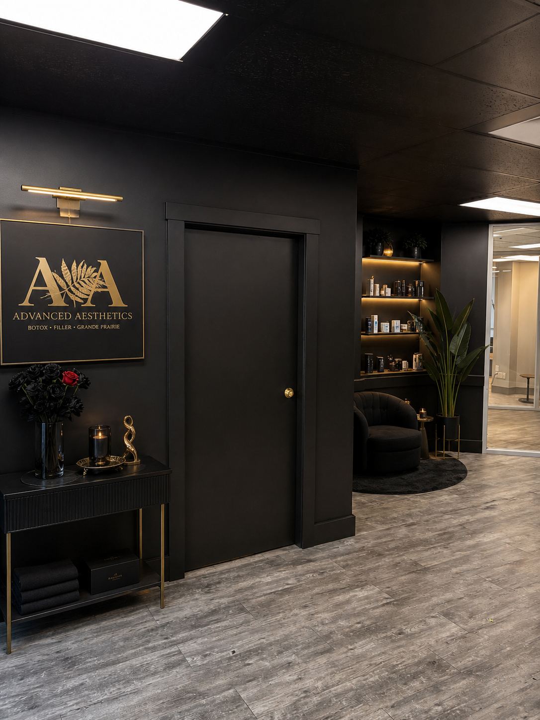 Inside the Advanced Aesthetics studio, black walls and gold accents